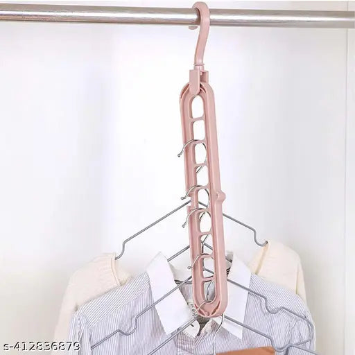 Multi-functional pink wardrobe organizer hanger with 9 slots for shirts, pants and accessories