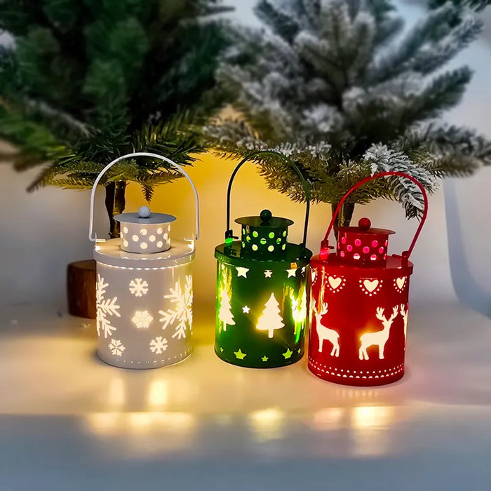 Three colorful lanterns with Christmas designs on a snowy background