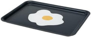 IKEA KEJSARFISK tray, patterned multicolour, measuring 28x37 cm (11x15"); features a bold black background with a playful central motif of a fried egg—white and yellow color contrasts pop against the dark base, giving the tray a quirky and modern aesthetic. Raised edges provide practical grip for serving, while the graphic styling adds character to everyday use – 50607690.