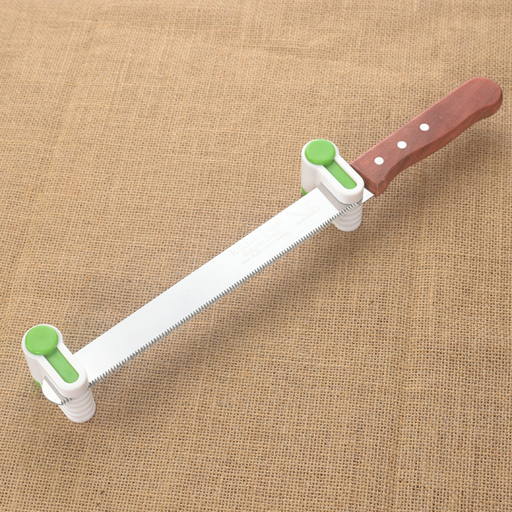 Cake layering tool with adjustable settings placed on a kitchen counter