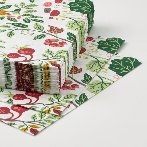 HAVSBRAXEN napkins styled on a green ceramic plate with black-handled cutlery, adding festive charm to a nature-themed table setting