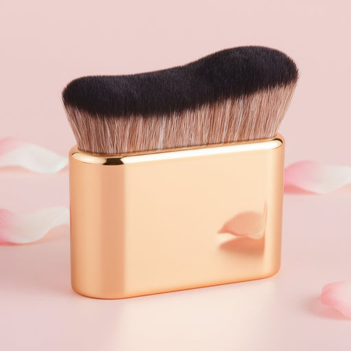  gold makeup brush with dense bristles on soft pink background lifestyle shot