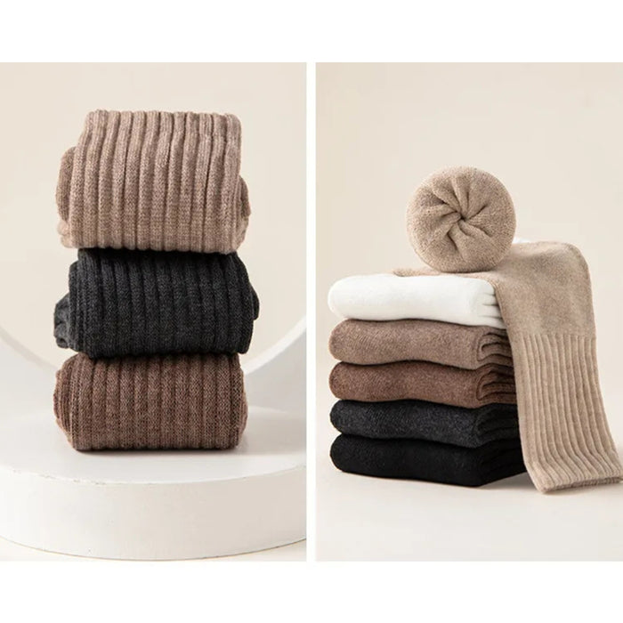 Stacks of ribbed knit tights in various colors on a white background