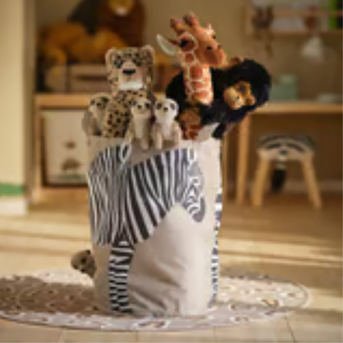 IKEA SANDLÖPARE storage bag – zebra-patterned toy bin filled with plush animals, placed on circular rug in kids’ room – 50603215

