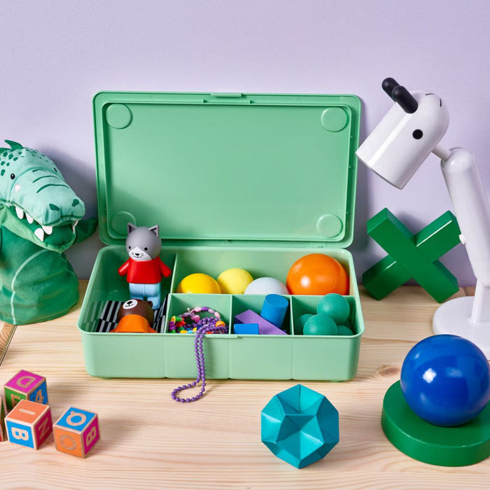  GLIS box used in kids’ play area, filled with colorful toys, balls, blocks, and geometric shapes for organized fun