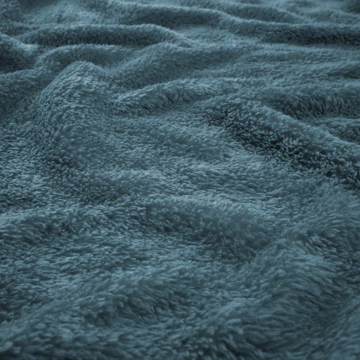 Close-up of IKEA TRATTVIVA blue fleece fabric showing thick plush texture
