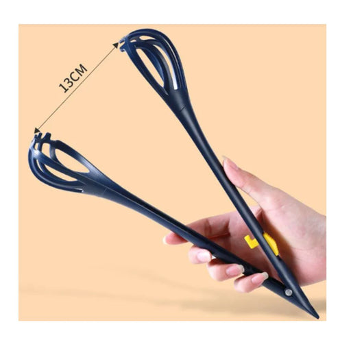 Black whisk with measurement label held by a hand on a beige background