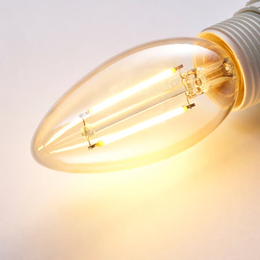 Close-up of a lit LED light bulb on a white background
