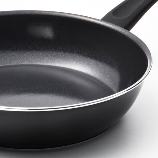 Black frying pan on a white background