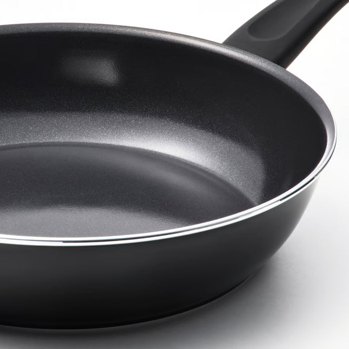 Black frying pan on a white background