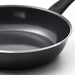 Black frying pan on a white background
