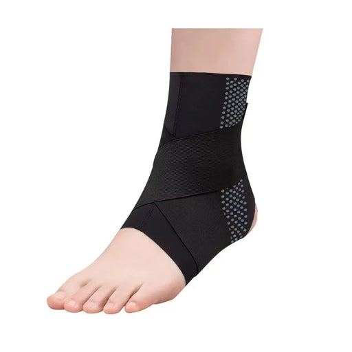 Black ankle support brace on a foot against a white background