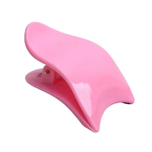 Pink hair clip on a white background