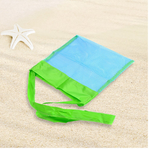 Blue and green mesh bag on sand with a starfish