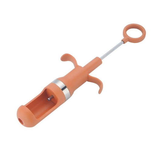 Orange handheld jujube seed remover with metal shaft and circular grip, designed for quick pit extraction