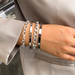 Stackable bracelet set displayed flat on a neutral background