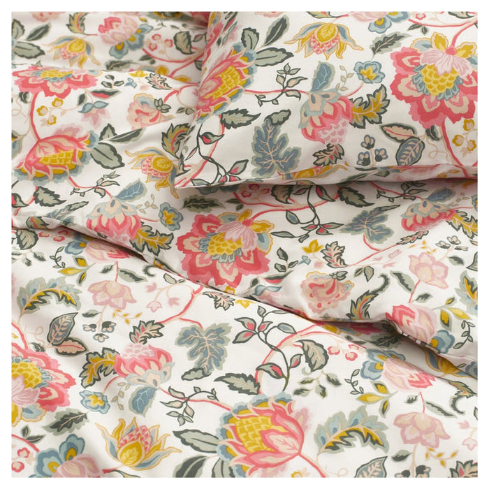 Floral fabric with pink, yellow, and green flowers on a white background