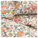 Floral fabric with pink, yellow, and green flowers on a white background