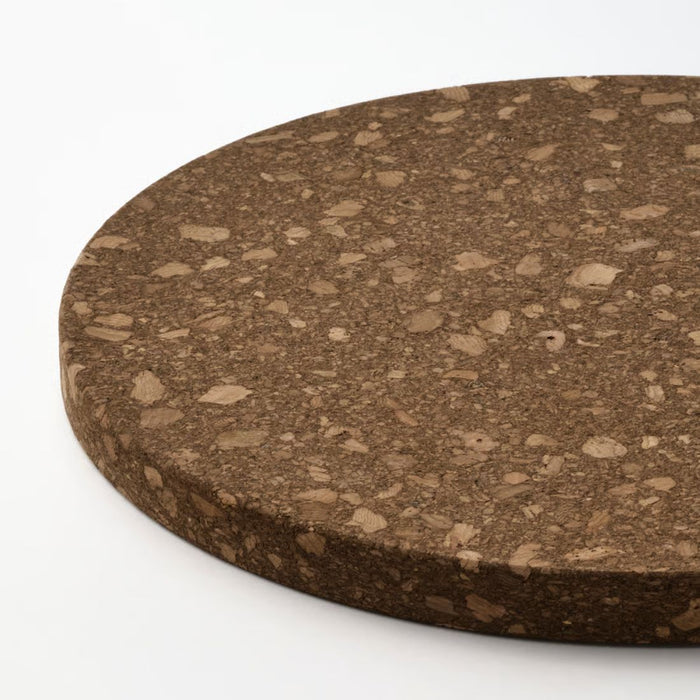 Round cork board with a textured surface on a white background