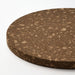 Round cork board with a textured surface on a white background