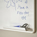  A whiteboard with a handwritten message in blue marker reading “Have a nice day,” decorated with two small hearts and a simple flower sketch. A tray below holds scissors and a blue marker
