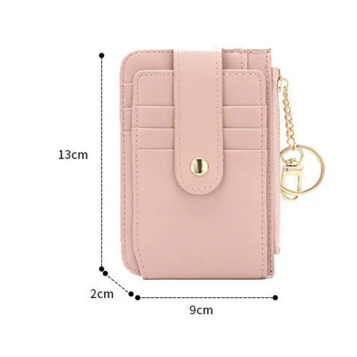 Pink wallet with keychain, measurements indicated on a white background