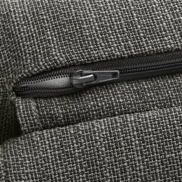 Close-up of black zipper on textured grey woven fabric, showing zipper teeth and pull tab; upholstery detail from IKEA cushion cover – 50582133