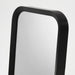 Close-up of LINDBYN table mirror in matte black finish on a vanity table