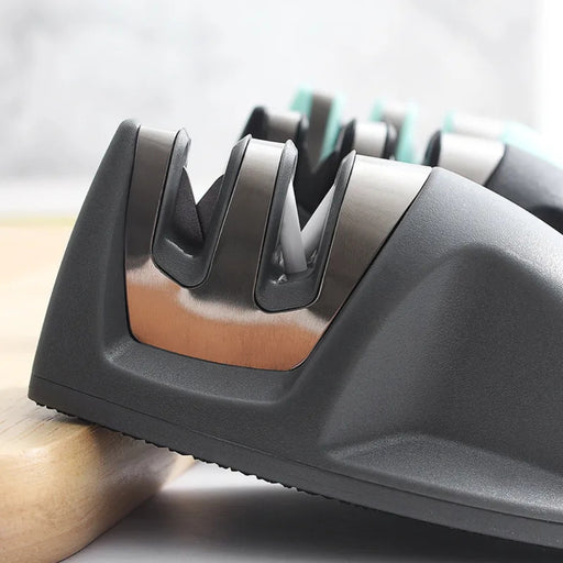 Knife sharpener on a wooden surface with a blurred background