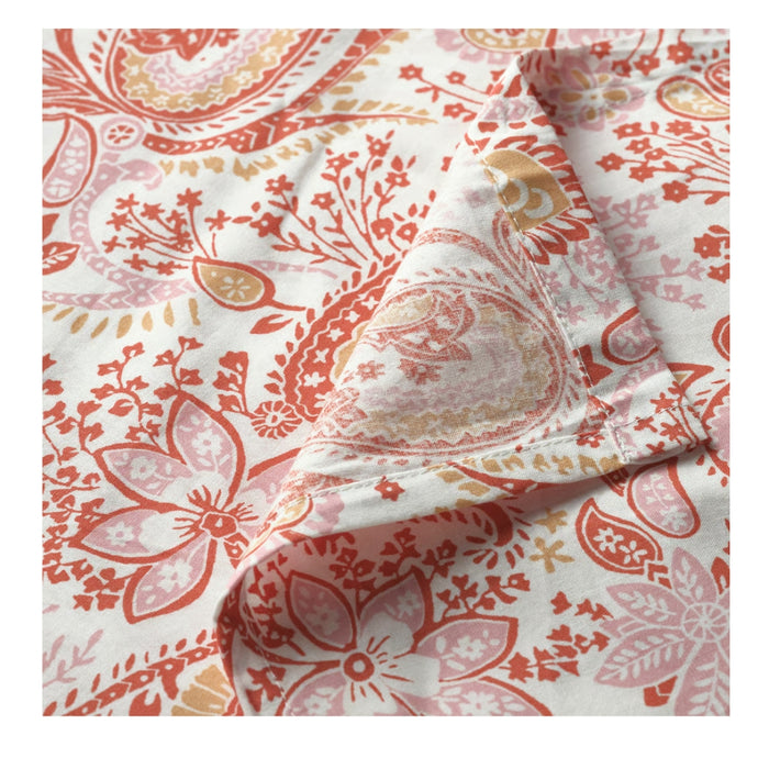 Floral patterned fabric with red and pink colors on a white background