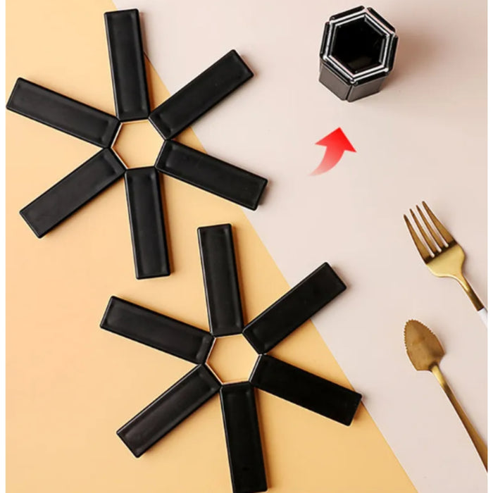 Black magnetic tiles on a beige and white background with a gold fork and knife.