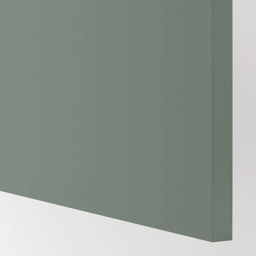 Green corner of a cabinet or wall unit on a white background