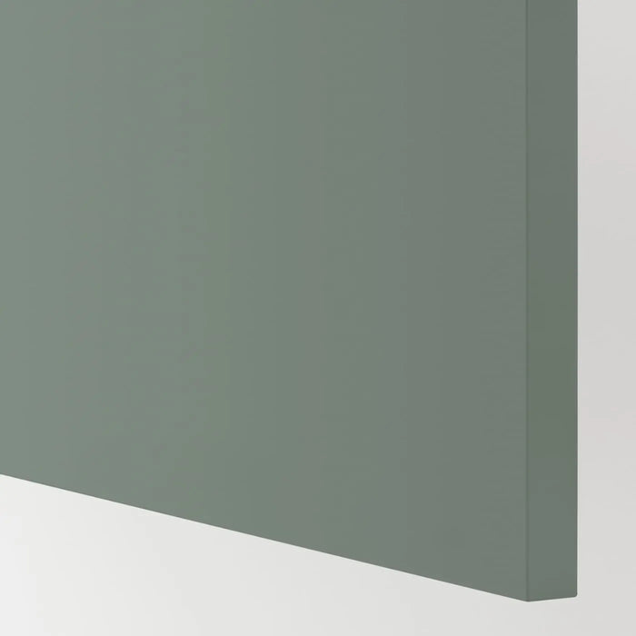 Green corner of a cabinet or wall unit on a white background