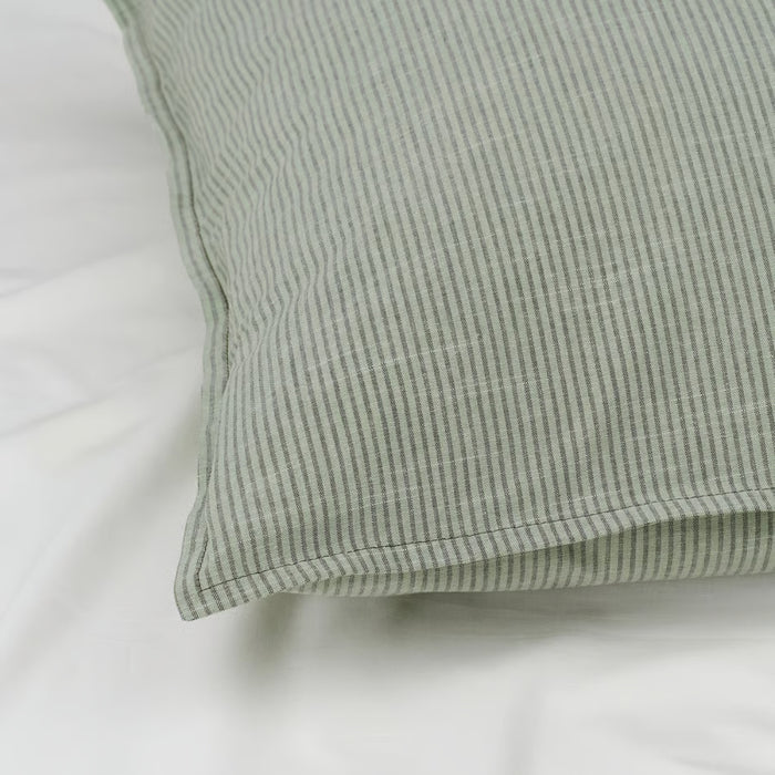 Green checkered pillow on a white background