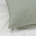 Green checkered pillow on a white background