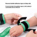 Kids anti-lost safety wrist band—green coiled traction rope linking adult and child wristbands; adult hand secures black Velcro strap on child’s wrist. On-image text highlights: “Reverse double adhesive tape on baby side – Prevent the baby from pulling it apart at will, making it comfortable and not offensive.” – 1600005922124 13241030.
