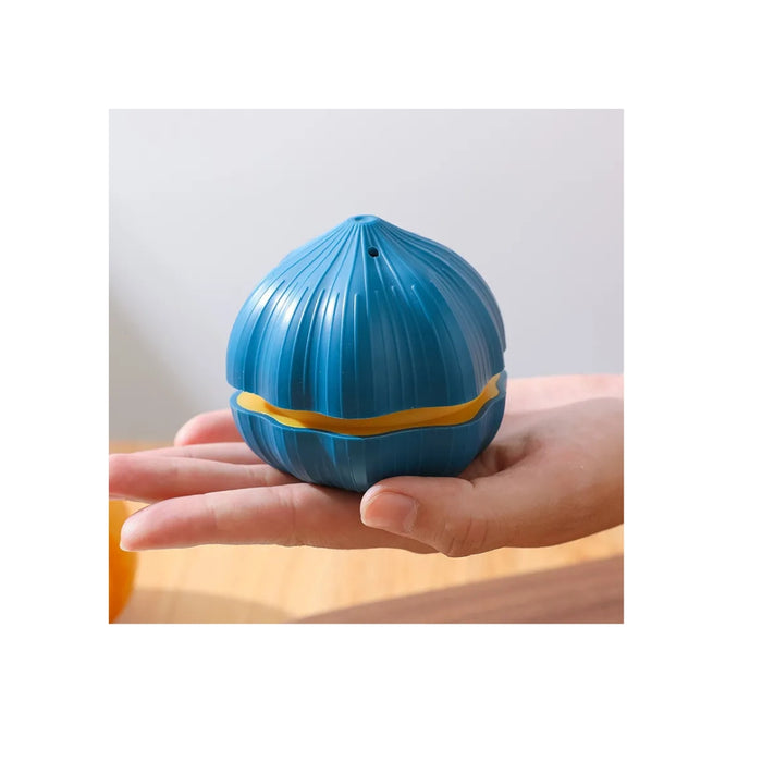 Blue and yellow ball held in a hand against a neutral background