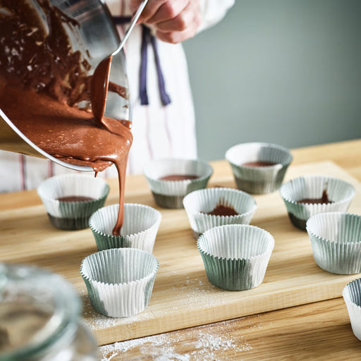 IKEA KRUSTISTEL Baking cup, grey/white (65 pack) – chocolate batter poured into paper liners for home baking prep – 90583833
