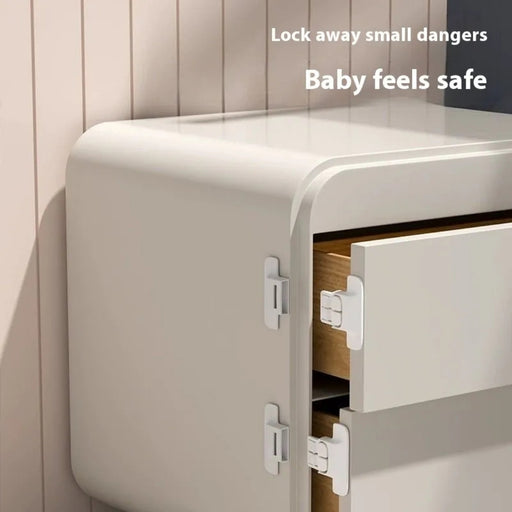 Small safe with open door on a neutral background, emphasizing safety.