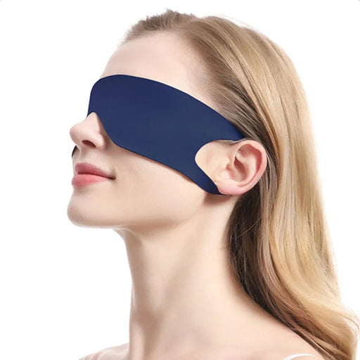 Woman wearing a blue sleep mask on a white background