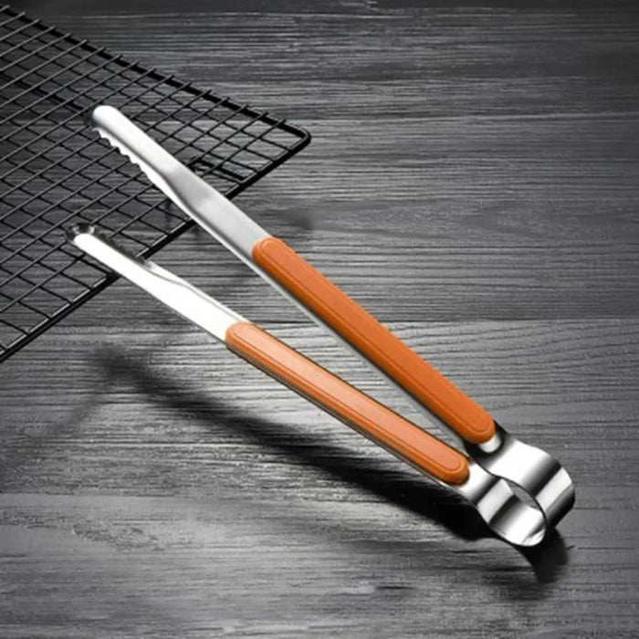 Kitchen tongs with yellow heat-resistant grips used to hold meat while cutting – multi-color PP strip for insulation and anti-scalding