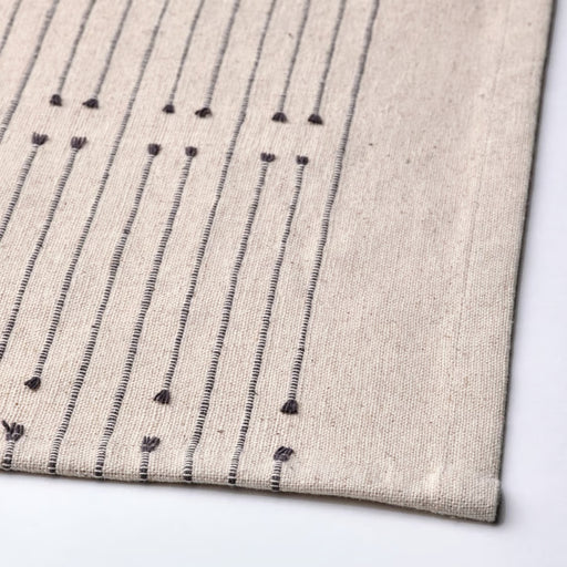 Textile with black pattern on a beige background