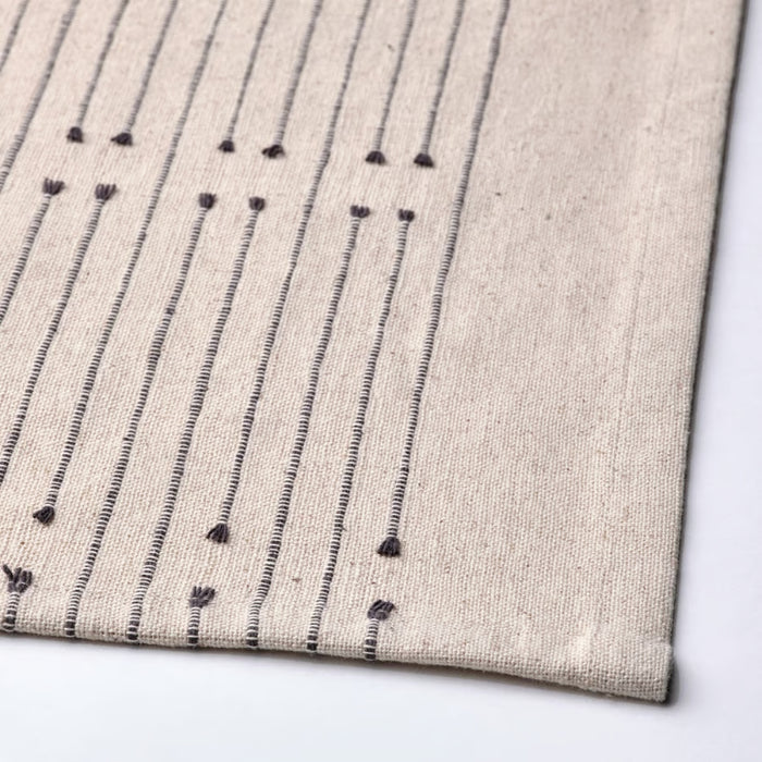 Textile with black pattern on a beige background