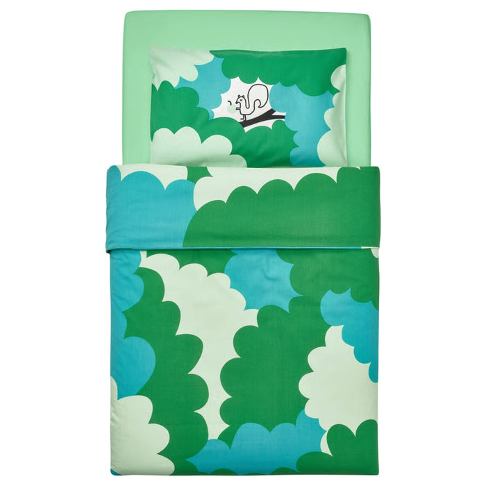 Children's bed with green and blue cloud-patterned bedding on a white background