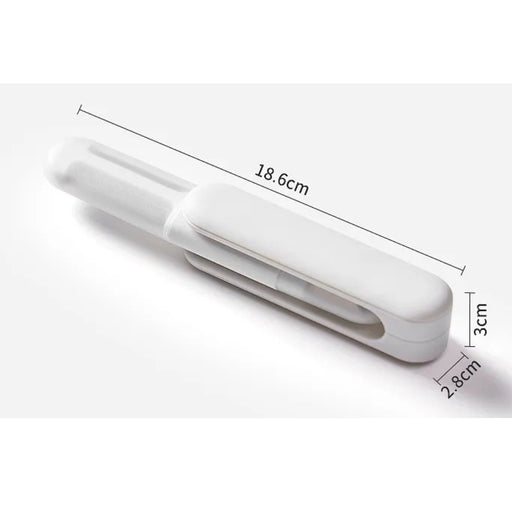 White plastic clip with measurements on a white background