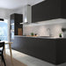 Modern kitchen interior featuring matte black NICKEBO drawer fronts with light countertop – 80537827