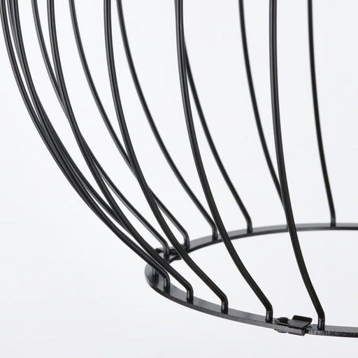 Close-up of a black wire basket on a white background