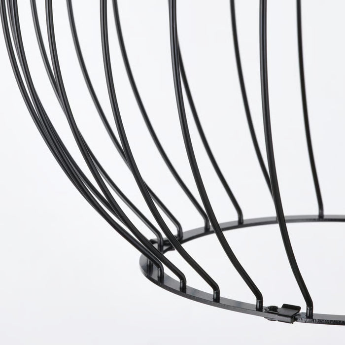 Close-up of a black wire basket on a white background