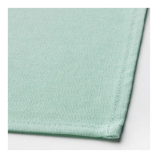 Close up of IKEA SVARTSENAP napkin fabric texture in light turquoise color