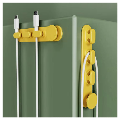 Yellow cable management system on a green surface